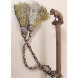 A Victorian fine parasol with carved wood dog formhandle, the silk shade embroidered violets and