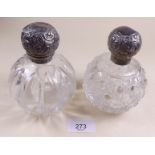 Two Victorian cut glass and silver topped toiletry bottles