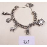 A silver charm bracelet and charms