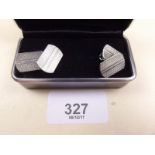 A pair of silver engine turned cufflinks - boxed
