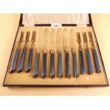 A blue handled silver plated dessert cutlery set - cased