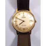 A 14 carat gold Omega gentlemans Automatic De Ville Seamaster wrist watch with original box and