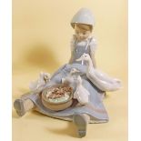 A Lladro group seated girl with duck and ducklings
