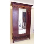 An Edwardian mahogany single door wardrobe with marquetry decoration