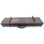 Leather motor case with brass corners, red baize lined fitted interior for up to 30 ins barrels