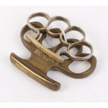 Brass war issue knuckle duster, with broad arrow stamped BC42 MII, plus one other