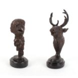 Two cold painted bronze busts, Eagle and Stag heads, on marble bases