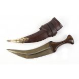 Arabian Jambiya, 7,1/2 ins blade, horn grip, in pierced decorated brass mounted leather scabbard,