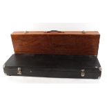 Two wooden gun transport cases