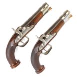 A pair of 32 bore continental percussion pistols, each with a 5 ins full stocked barrel, steel