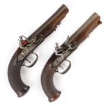 A pair of 16 bore continental flintlock travelling pistols, each with a 6,1/4 ins swamped