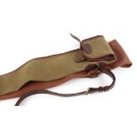 Holland & Holland canvas and leather gun slip, max. internal length 49 ins, together with a Brady