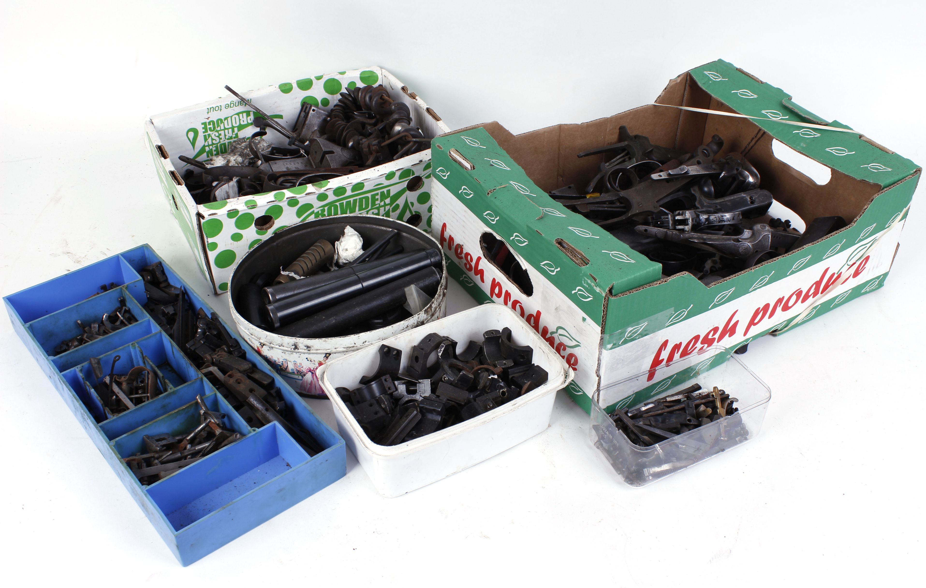 Large quantity of various gun action parts, trigger guards, hammers, mounts and other parts and