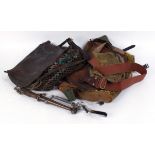 Four various leather, canvas and leather game bags, game carriers, Remington clay hand thrower,