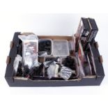 Box containing scope mounts, gun cleaning kits, magazines, gun oil, two spotting scope tripods,