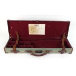 Canvas and leather gun case for a Westley Richards Double Rifle, brass mounted with red baize