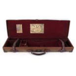 Canvas and leather gun case, claret baize lined fitted interior for up to 30 ins barrels,