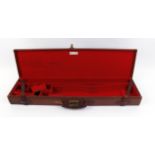 Oak and leather double gun case, claret red baize lined fitted interior for two guns with up to