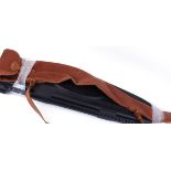 Flamneau hard plastic rifle case; Brady canvas and leather rifle slip, each with scope allowance (