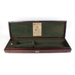 Mahogany gun case, fitted interior for up to 30 ins barrels, brass corners, inset ring handle,