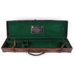 Leather gun case, brass mounted, green baize lined fitted interior for up to 30½ ins barrels, Purdey