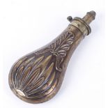 Copper and brass powder flask, relief decoration, 7¾ ins overall