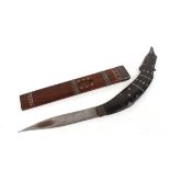 Indonesian knife with decorated grips and decorated wooden sheath