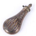 Copper and brass powder flask, relief decoration, 7¾ ins overall
