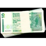 Standard Chartered Bank, a consecutive run of 100 x $10, 1995, serial number DA382901-000, green on