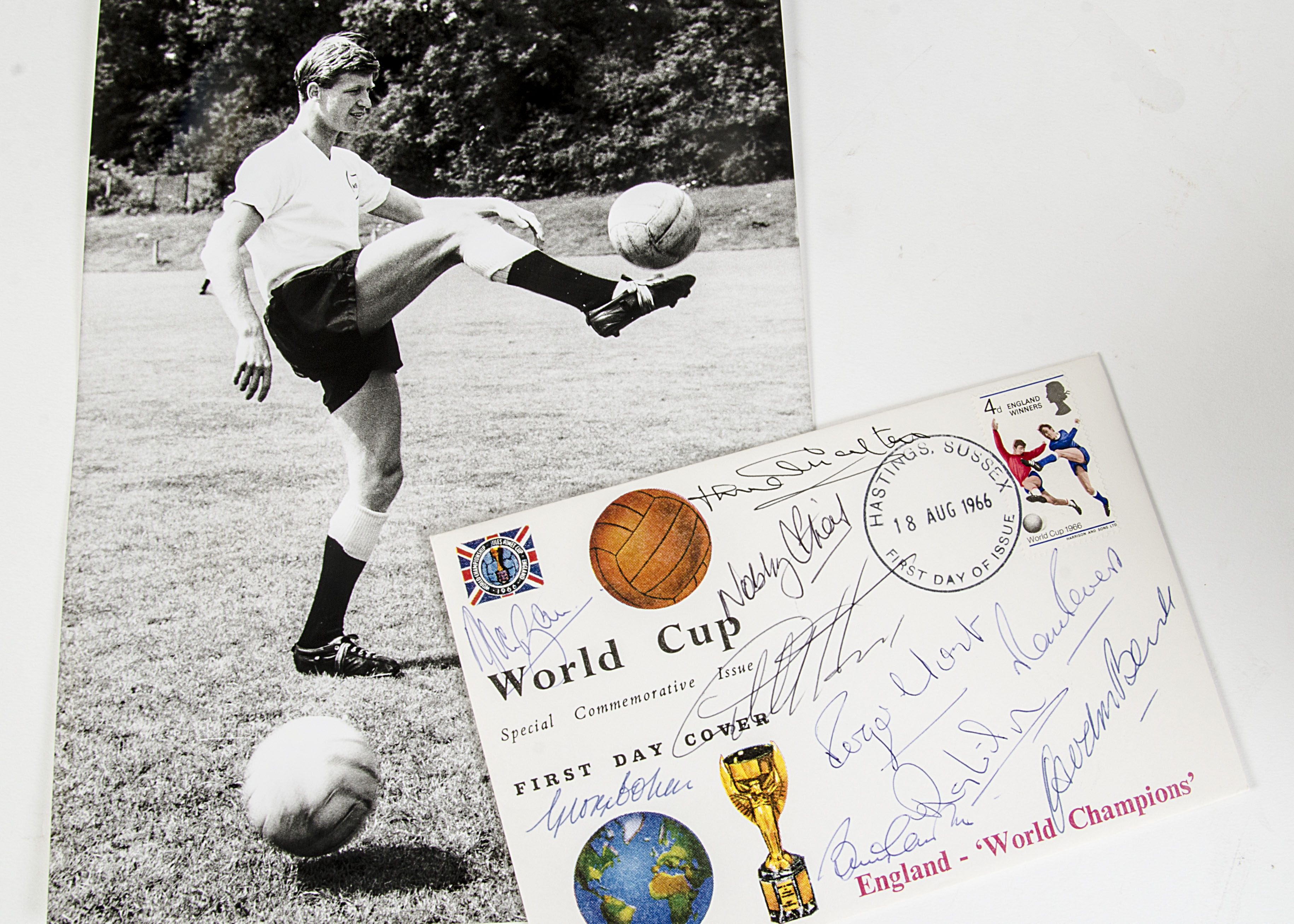 World Cup, two photgraphs from the 1966 final, Geoff Hurst scoring and holding the trophy plus a
