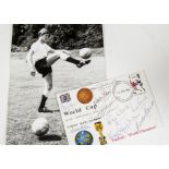 World Cup, two photgraphs from the 1966 final, Geoff Hurst scoring and holding the trophy plus a