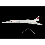 Aviation, a large desk model of Concorde, on chrome stand, 61cm x 26cm made in resin or similar in