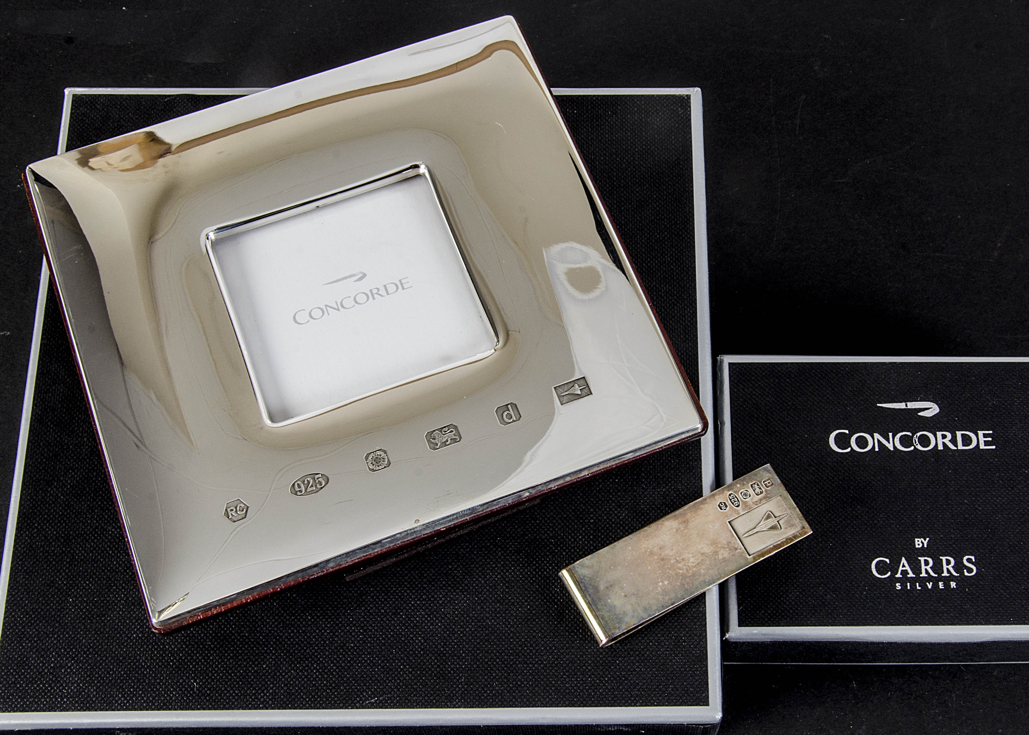 Aviation, a Hallmarked silver photograph frame by Carrs 12cm x 12cm with a 5cm x 5cm centre together