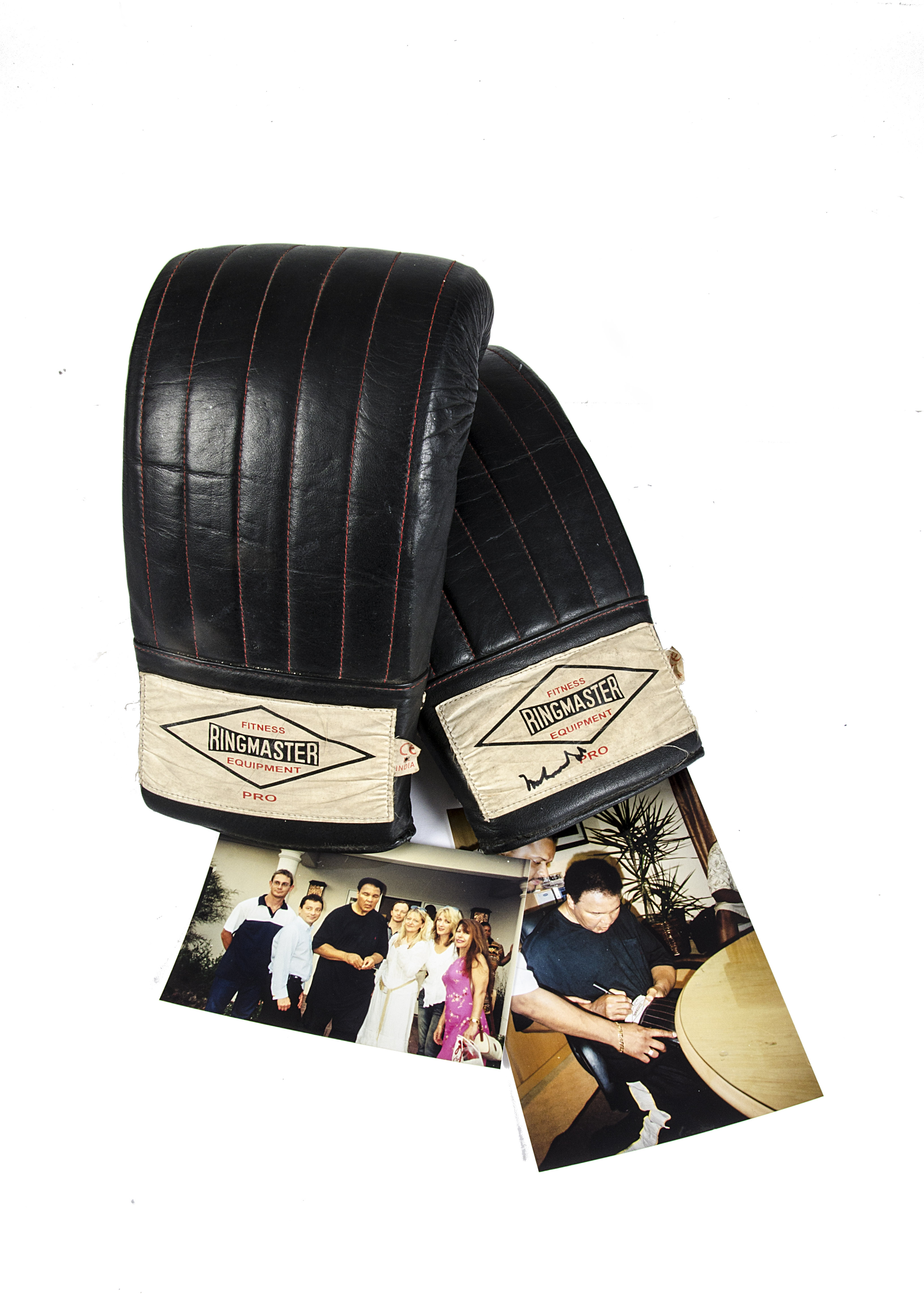 Muhammed Ali, a signed Ringmaster training glove with supporting photographs of the signing. The