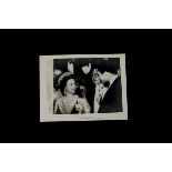 Muhammad Ali, an autographed photograph of Ali meeting Queen Elizabeth in Washington. The photograph