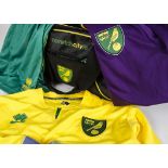 Norwich City FC, eight short sleeved shirts, two shorts plus small kit bag, shirts yellow/green