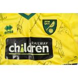 Norwich City FC, signed yellow with green trim shirt (18 autographs) Railway Children logo plus