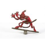 Motoring, a vintage Red Devil, car mascot, with horned, long tailed devil mounted on cross member by