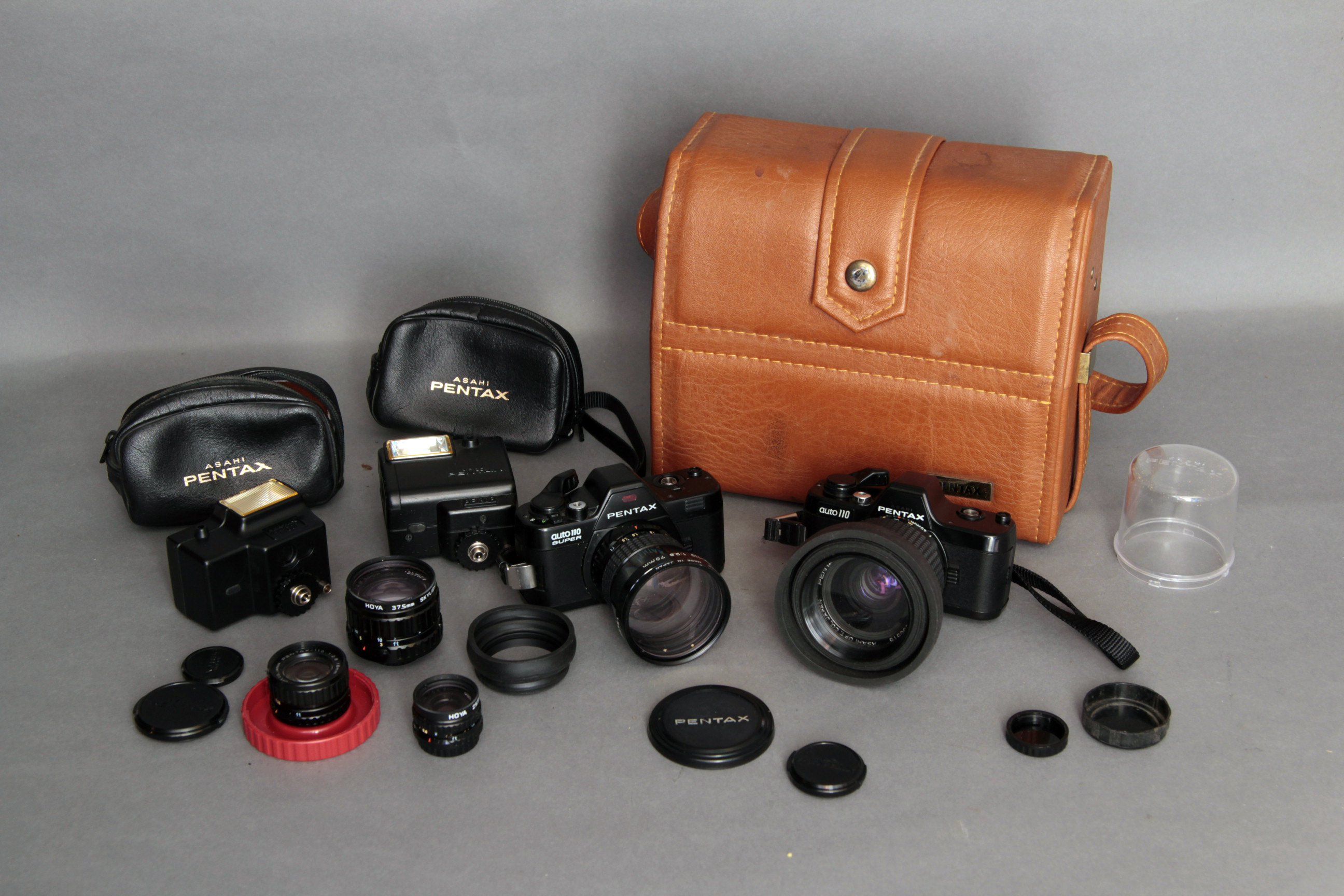 Pentax 110 outfit, an Auto 110 body, an Auto 110 Super body, 18mm, 24mm, 50mm, 70mm and 20-40mm