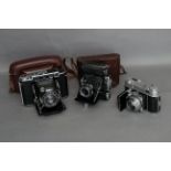 Zeiss Super Ikonta Cameras, a 530/16 model, a 531 model together with a Retina IIa camera