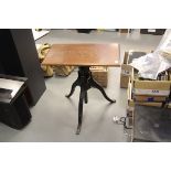A Cast Iron & Oak Mechanical Tripod Table, crank-operated height adjustment, for studio camera or