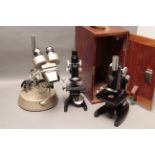 Leitz Microscope, a student model together with a cased Zeiss example and a Prior example on stand