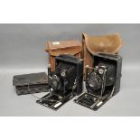 Two Folding Plate Cameras, in maker's cases