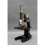 A Bausch & Lomb Microscope, black and brass, with two objectives, in maker's case