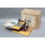 An Essex Miniature Sewing Machine, with instructions in maker's box