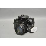 A Minolta X-1 SLR Camera, black, with Makinon f/2.8 28mm lens