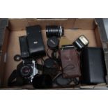 A Canon AE-1 SLR Camera, toegher with other lenses and accessories (a lot)