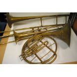 Brass Instruments, two trombones and one French horn all have been well used and have some damage