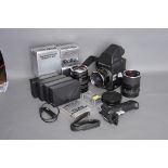 A Rolleiflex SLX Camera, together with Planar f/2.8 80mm, Distagon f/4 50mm and Sonnar f/4 150mm