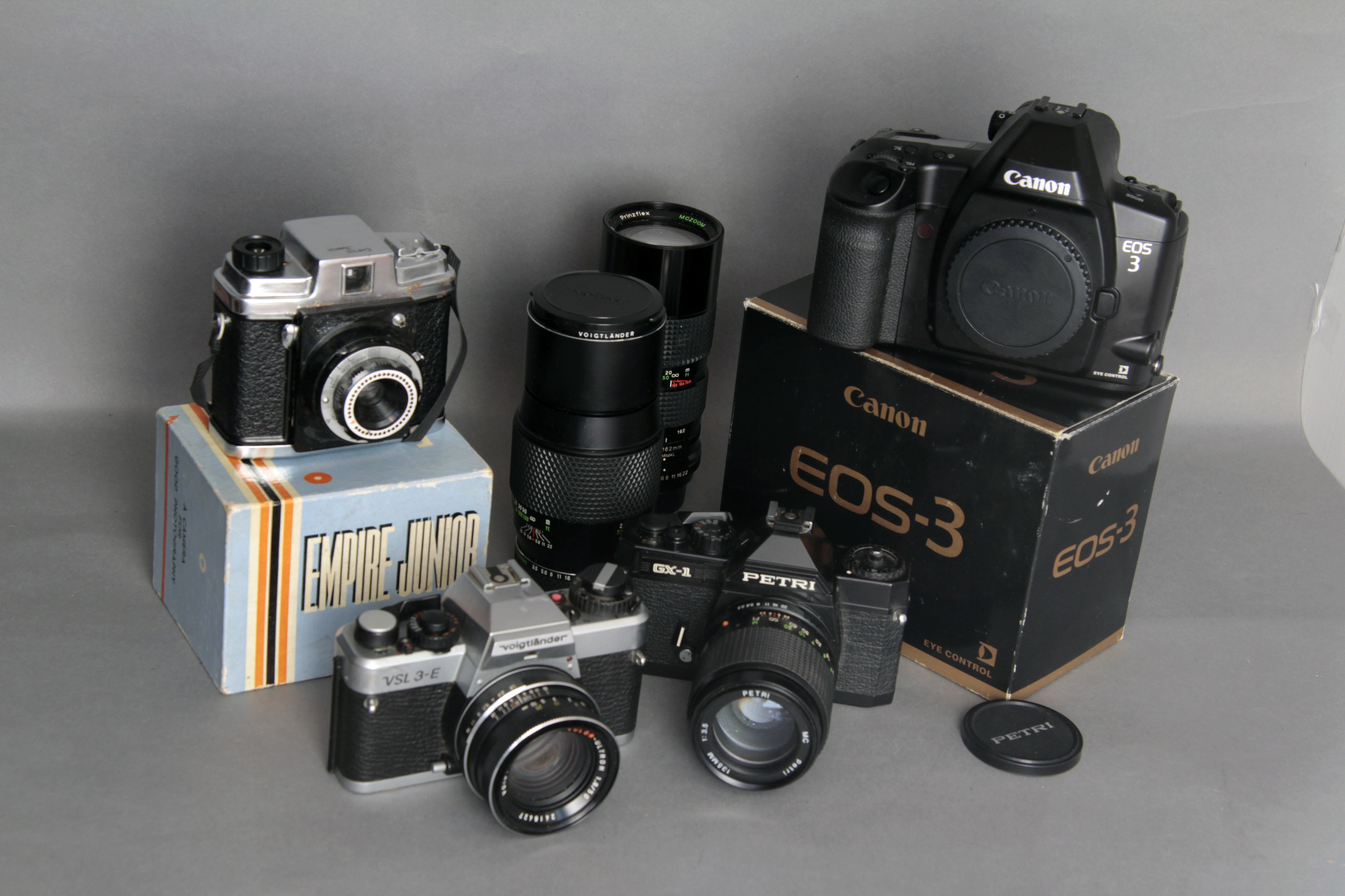 Cameras, a Canon EOS3 body, boxed, Voightländer and Petrie SLR cameras and more